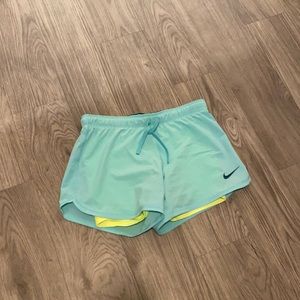 Light teal Nike running shorts